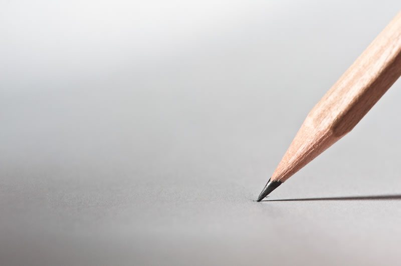Blank page featuring lead pencil beginning to draw with the word CONTACT
